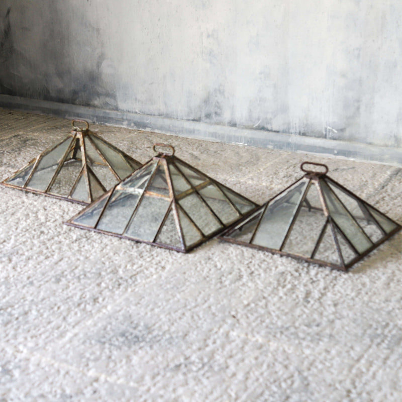 Set of three Victorian iron and glass pyramid garden cloches