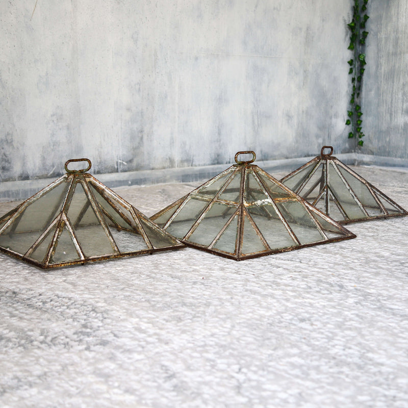 Set of three Victorian iron and glass pyramid garden cloches
