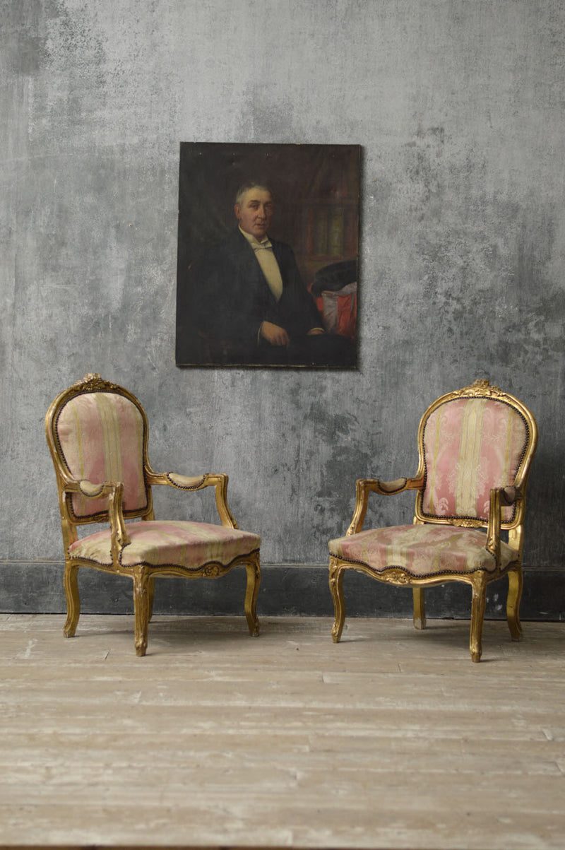 A pair of Louis Philippe gilt chairs