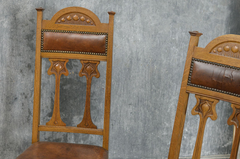 A set of four Arts and Crafts style  dinning chairs.