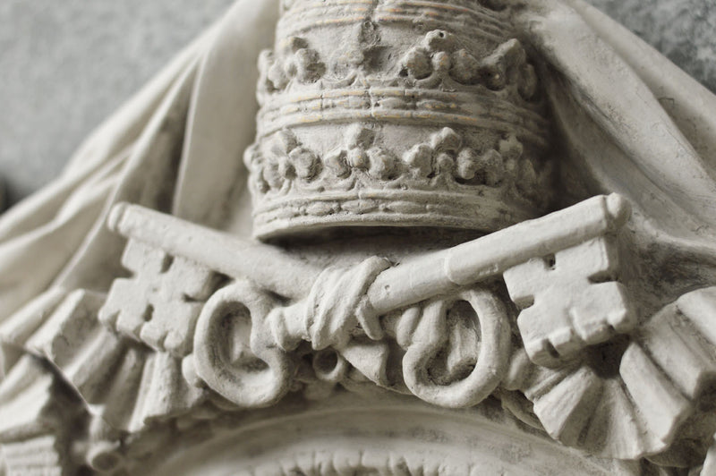 An Italian mirror moulded from a Vatican window.