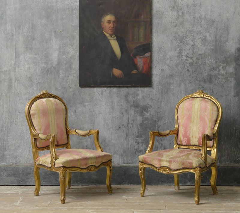 A pair of Louis Philippe gilt chairs